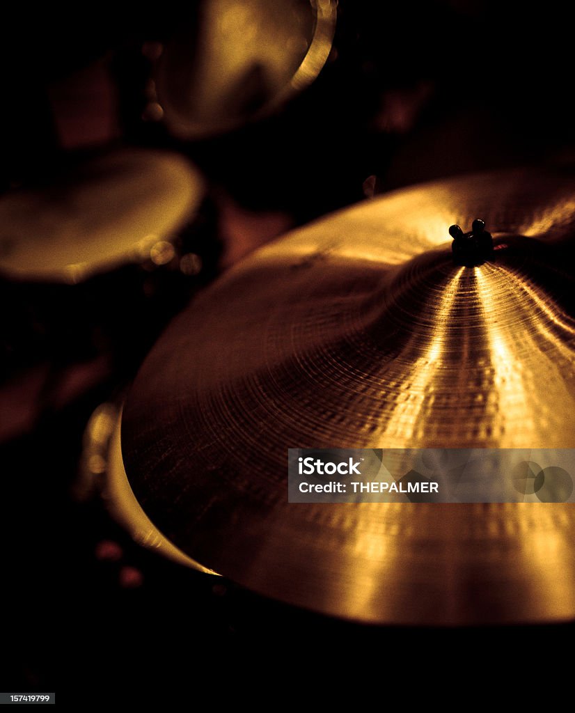 cymbals cymbals in golden sepia, low light and shallow DOF Cymbal Stock Photo