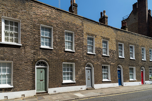 A row of brick built terraced houses on Gayfere Street, London.