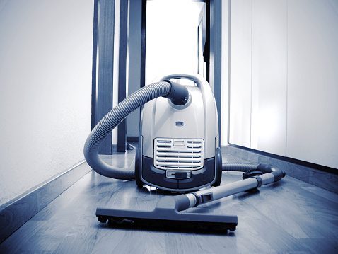 Tidy up the office room - vacuum cleaner