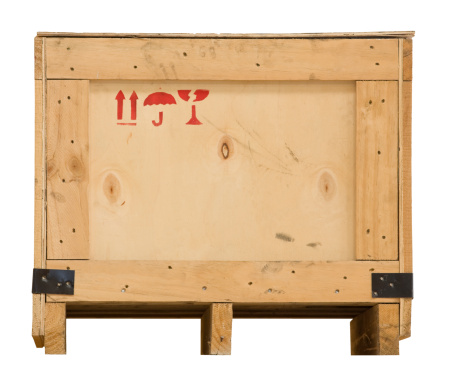 Wooden packaging crate on a pallet with clipping path. 