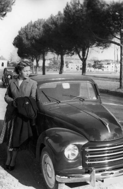 istock Woman with Car,1938.Black And White 157420199