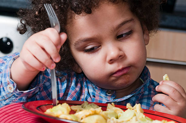 istock Child looking bored with her plate 157420646