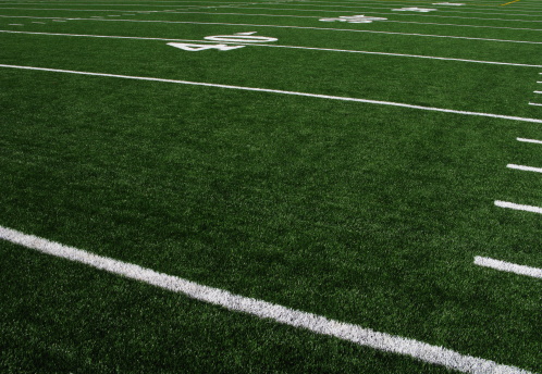 A view of an artificial turf football field.