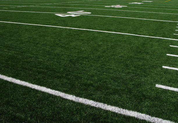 Football Field Forty Yardline Artificial Turf A view of an artificial turf football field. american football field stock pictures, royalty-free photos & images