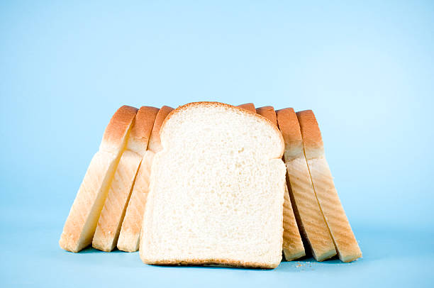 istock Loaf of White Bread on Blue 157420878