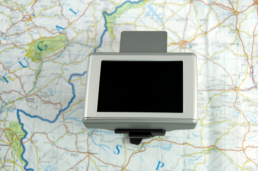 Tablet with navigator application. Maps and road maps.
