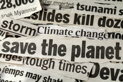 newspaper cuttings with focus on the headline 'save the planet'