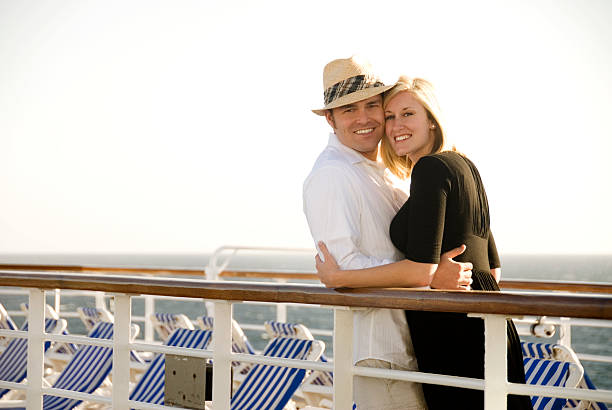 Cute couple on cruise ship Young couple on their honeymoon on a cruise ship. cruise ship people stock pictures, royalty-free photos & images