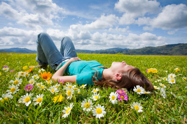 istock girl resting in meadow 157421725