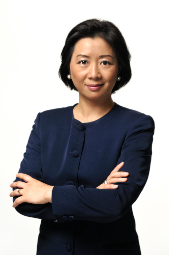 Portrait of a successful middle-aged  Chinese executive with arms crossed