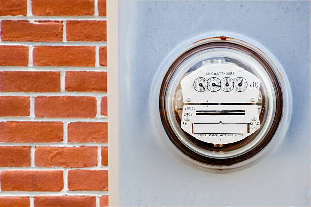 Electric meter on house stock photo