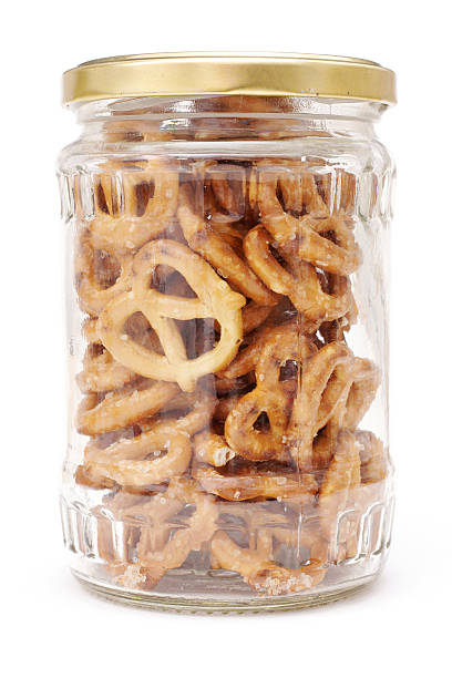 pretzels in clear glass jar stock photo