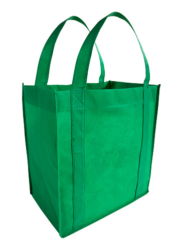 An empty reusable, eco-friendly, green shopping bag. With clipping path.