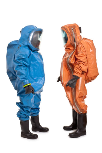 istock two men wearing chemical protection suit 157422669
