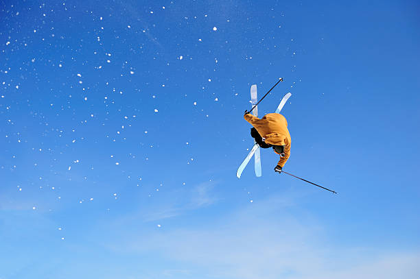 istock Skier Iron Cross stunt against blue sky 157422994