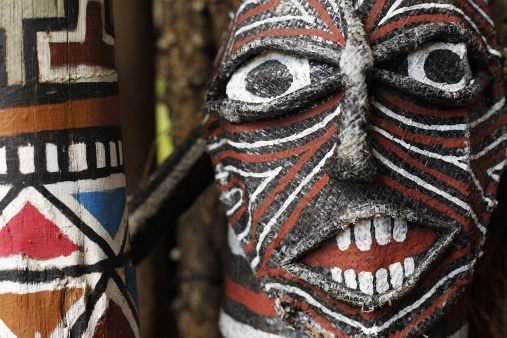 A Carved wooden Maori masks at Te Puia near Rotorua in New Zealand North Island