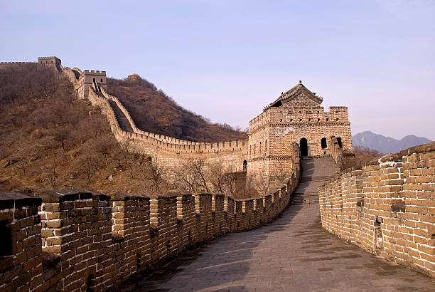 Standing on the Great Wall Of China Standing on top of the the Great Wall Of China and looking at a section with a watchtower and with no people. Behind the tower the wall runs up a mountain slope and more towers can be seen. This section is at Mutianyu, abouth 1 hour from Beijing. badaling great wall stock pictures, royalty-free photos & images