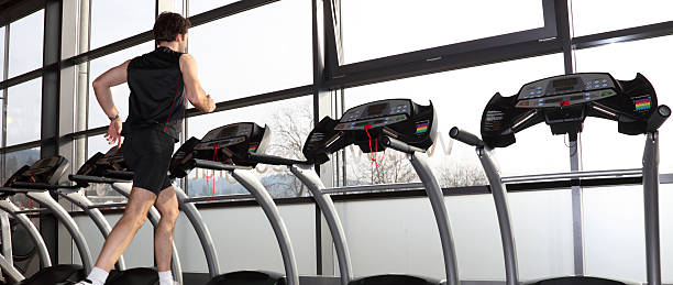 Man on a treadmill stock photo