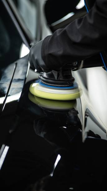 istock Car paint polishing in a car detailing studio 1574235254