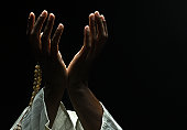 hands holding a muslim prayer beads