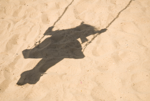 girl on a swing shadow