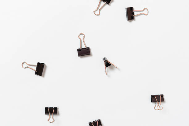 istock some metal paper binder clips flat lay, minimalistic isolated concept 1574236698