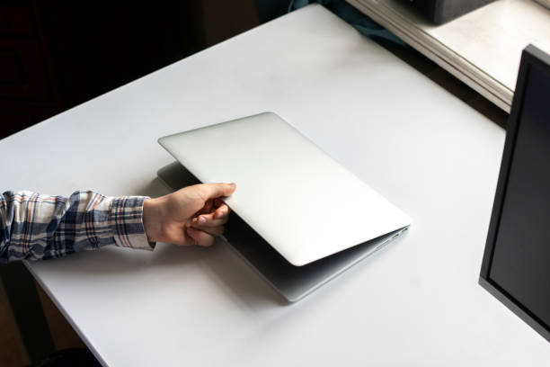 istock person opens laptop computer to do some online work on project 1574238036