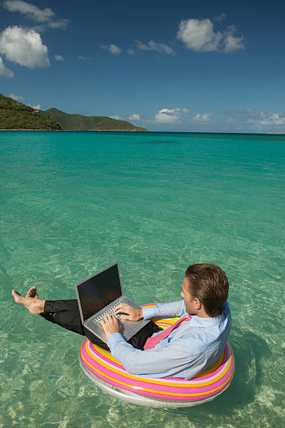 istock Relaxed Businessman Typing Blank Laptop Tropical Water 157423866