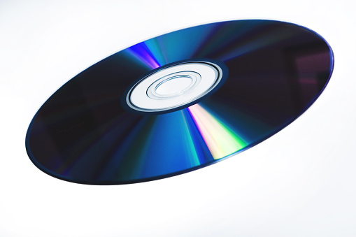 A blank DVD or CD in a plastic case on white background