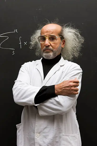 man with a mad hair and a labcoat infront of a blackboard,, holding a piece of chalk