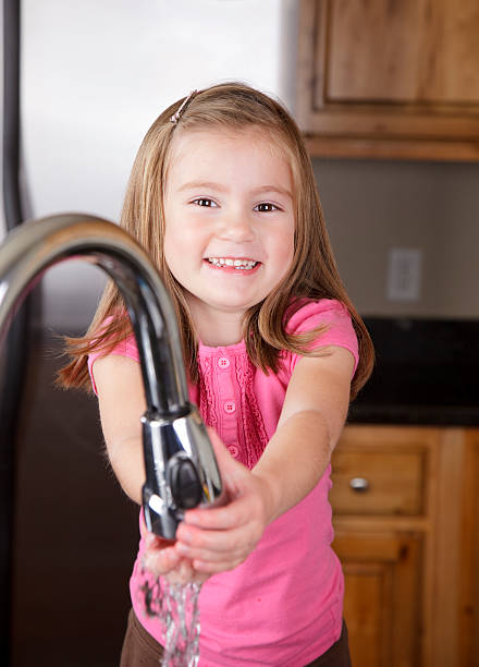 istock Little Girl Washing Her Hands 157424224