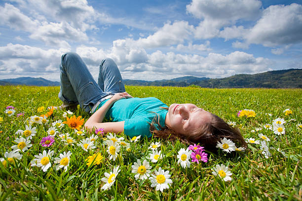 istock Girl lying down in meadow 157424410