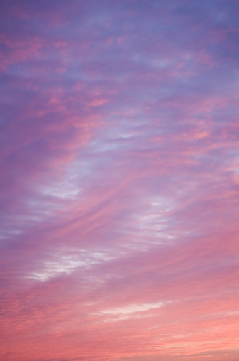 sunset with blue sky and pastel colored clouds
