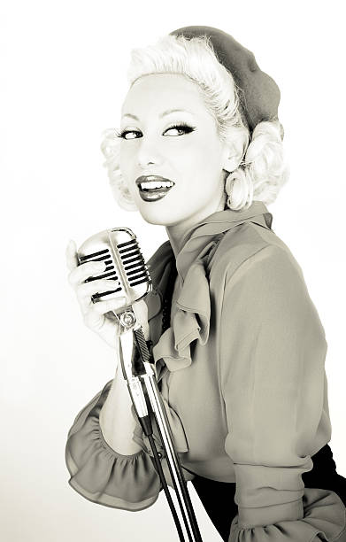 Retro Starlet With Microphone  40s pin up girls stock pictures, royalty-free photos & images