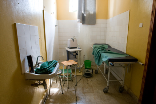 A small examination Room in a hospital in Jinka, Ethiopia. It has a bench, chair, sink and ultra sound machine.