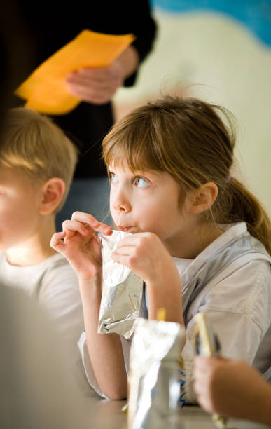 Little Girl Drinking Out of Straw stock photo