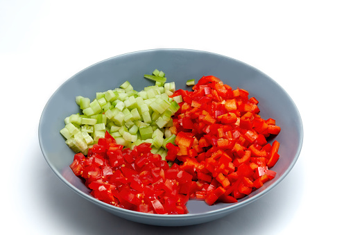Sliced peppers, cucumbers and tomatoes prepared.