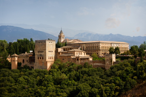 Autumn season fall Background with The landscape  view with Alhambra of Granada, Spain. Alhambra fortress and Albaicin quarter at twilight sky scene