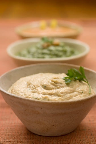 Hummus, spinach dip and roasted red pepper dip