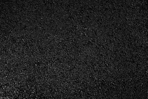 Hot fresh black fine rolled asphalt, background. 