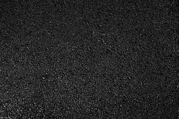 Hot fresh black fine rolled asphalt, background. 