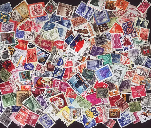 Colorful vintage, cancelled, stamps from around the world.