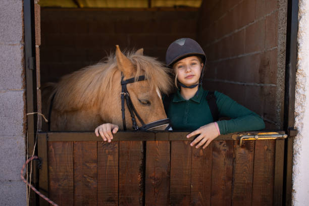 istock Girl with her horse 1574259182