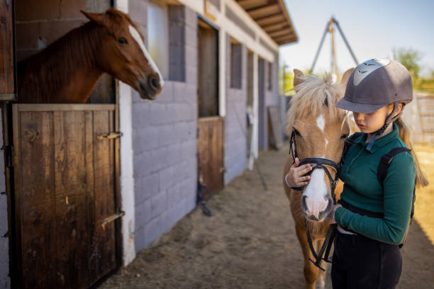 istock Girl with her horse 1574259279