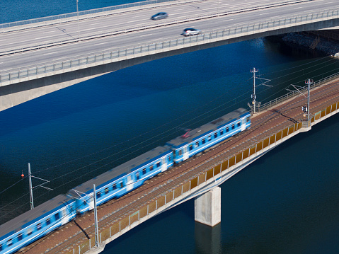 A fork in the railroad tracks in two directions. A close-up view of a railroad track. Concept of industrial logistic and transportation background