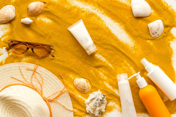istock Beach accessoties with sunscreen cosmetic and straw hat. Summer beach concept flatlay 1574271001