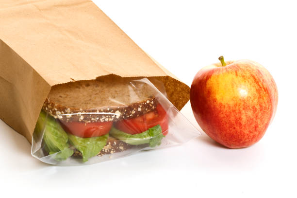 istock Sandwich in a bag with an apple on the side 157427639