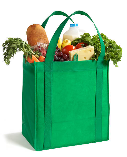 Reusable Eco Friendly Grocery Bag A reusable and recyclable grocery bag filled with food. reusable bag stock pictures, royalty-free photos & images