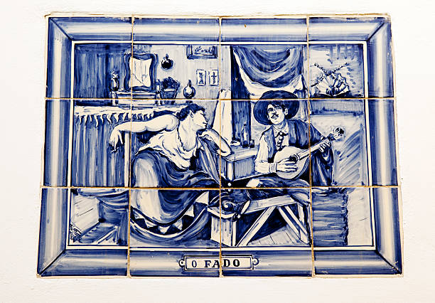Old tile on side of building in Lisbon depicting the traditional Fado style of music