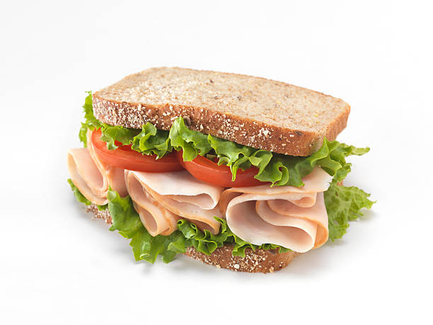sandwich di tacchino affumicato fette - panino ripieno foto e immagini stock